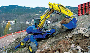 excavadora mediana / con neumáticos / Tier 3 / para obra de construcción