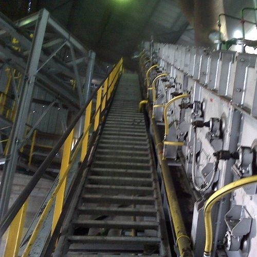 Transportador de banda - Ecobelt® DRI - Magaldi Power SpA - inclinado / de manipulación / cerrado