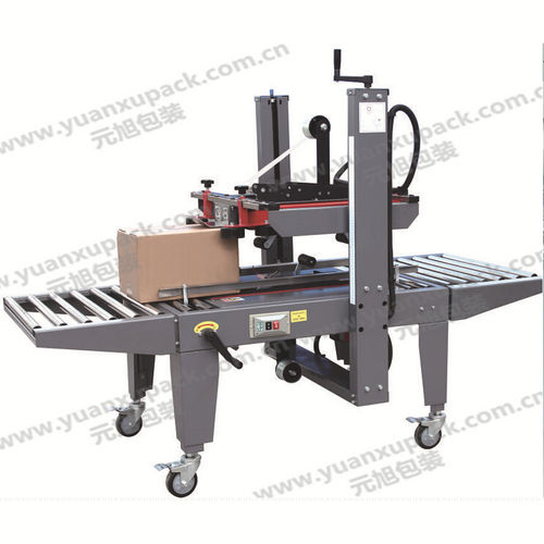Precintadora de cajas de cartón de doble solapa - YK-07B - Yuanxu Packing(shanghai) Machinery Co., LTD - cinta adhesiva / semiautomática