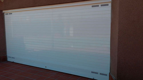 Puerta enrollable - Talleres Alfa Torres - de aluminio / industrial / de seguridad