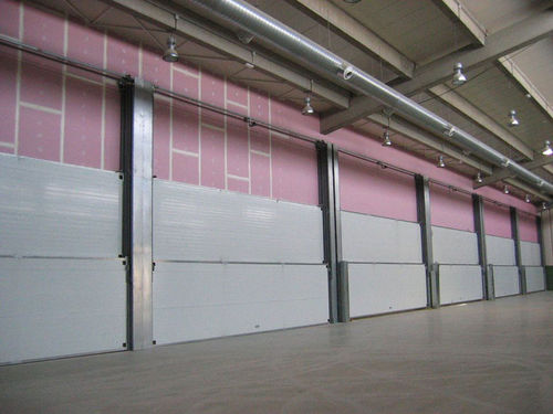 Puerta corredera vertical - Talleres Alfa Torres - multihojas / de metal / industrial