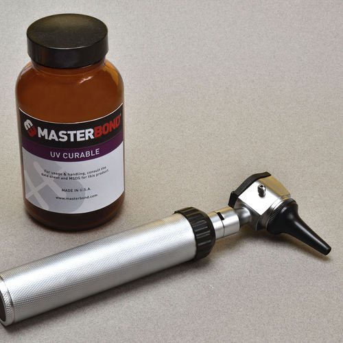 Cola de polimerización por UV - UV18S - Master Bond - polímero / para metal / para vidrio