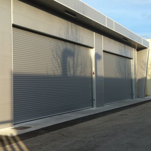 Puerta levadiza corredera - Tecno Teck - Tecnoindustriale s.r.l. - para interior / aislada