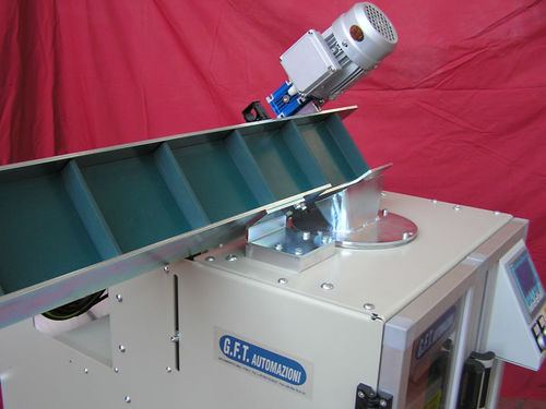Alimentador de banda - G.F.T. AUTOMAZIONI - para máquina de embalaje / motorizado / continuo