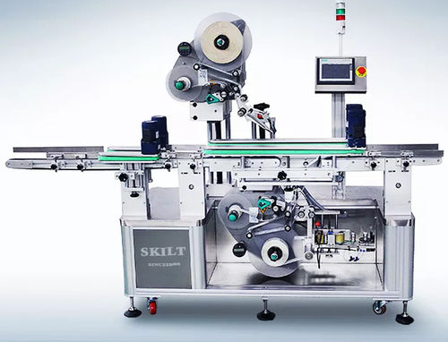 Etiquetadora controlada por PLC - UDPM-ALS104 Series - skiltpack - de cartón / de bolsas / para aplicación en la parte superior del producto