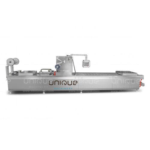 Máquina de acondicionamiento automática - Zibo Unique Machinery Co., Ltd. - de vacío / con film / para productos alimentarios