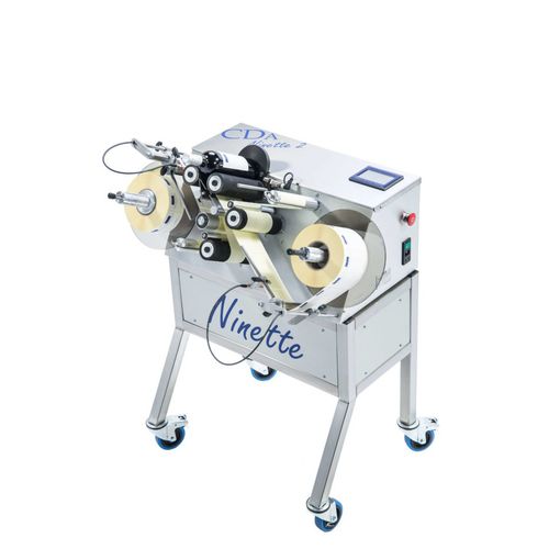 Etiquetadora semiautomática - Ninette 2 - CDA - para productos químicos / para botellas / para aplicación en el lateral del producto