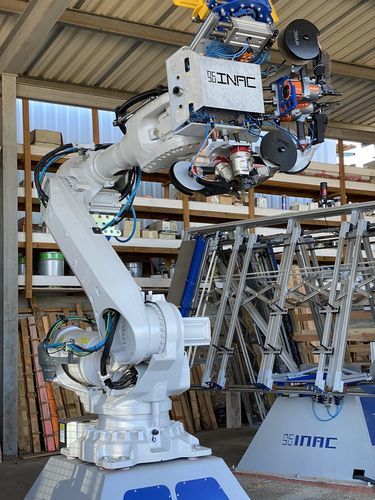 Línea de paletización y envasado robotizada - INAC