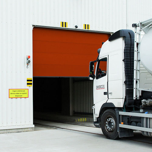 Puerta seccional - OH1042S - ASSA ABLOY Entrance Systems - de aluminio / industrial / para exteriores
