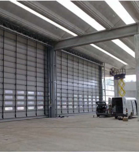 Puerta apilable - Pack® - B.M.P. srl - de acero galvanizado / de hangar / industrial