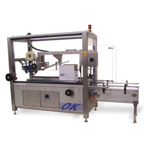 Precintadora de cajas de cartón automática - Supertaper 1A - OK International - de doble solapa / cinta adhesiva