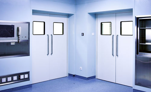 Puerta abatible - PUERTAS FERROFLEX SL - con bisagra / multihojas / de acero inoxidable