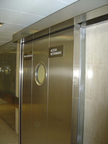 Puerta corredera - ALFATECO MADRID S.A. - de acero inoxidable / de aluminio anodizado / para interior