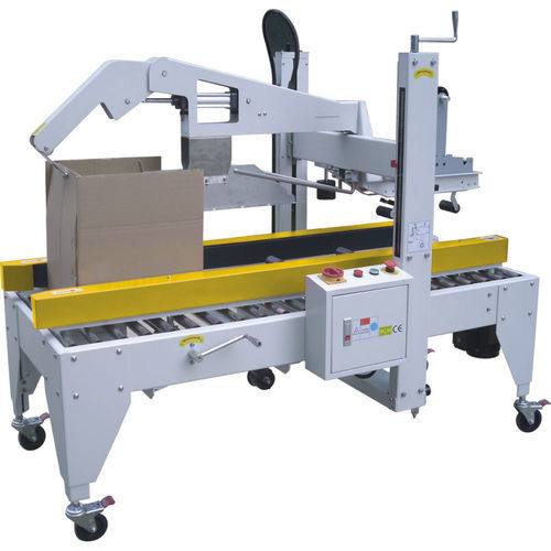 Precintadora de cajas de cartón con cuatro solapas - SPC-50  - SHANDONG  SINOLION  MACHINERY  CORP  LTD - cinta adhesiva / semiautomática