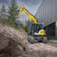 excavadora intermedia / con orugas / diésel / para obra de construcción